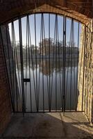 Panorama of Wroclaw, from the side of Ostrow Tumski through the lattice door to the Oder River, Poland. photo