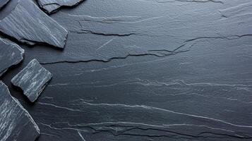 Close-up of natural slate stone texture with unique patterns and rich colors, perfect for background and design use. photo