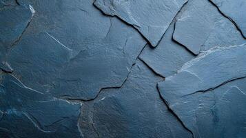 A textured slate background featuring dark blue and gray tones, perfect for design and architectural projects. photo