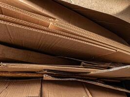 A close-up of corrugated cardboard layers, showcasing the intricate wave texture and structure, suitable for illustrating packaging, recycling, industrial, and material design concepts. photo