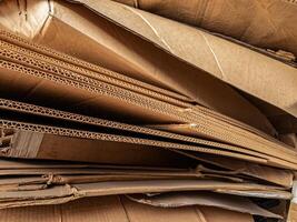 Stacked corrugated cardboard layers in close-up, displaying the detailed wave structure and texture, ideal for packaging, recycling, industry, and material design themes. photo