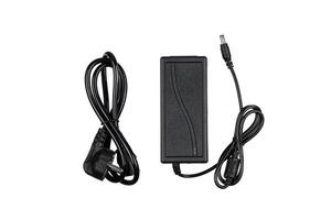 A black power adapter with two cables, one with a plug and the other with a connector, isolated on a white background, used for electronic devices. photo