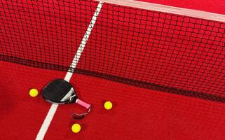 professional paddle tennis racket with natural lighting on red background. Horizontal sport theme poster, greeting cards, headers, website and app photo