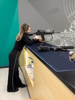 Shooters practicing tactical shooting in a modern indoor gun range. photo