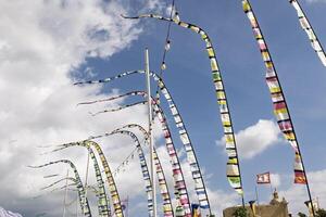 Colorful flags fluttering in the wind, creating a vibrant and dynamic scene photo