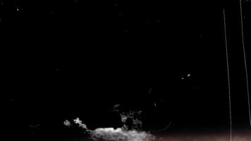 Grunge texture overlay on black background. Light transition video
