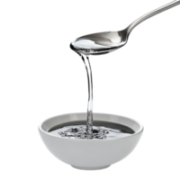 Liquid gracefully pours from a spoon into a white bowl creating a smooth surface, spoon with liquid pouring out it in a bowl, Transparent background png