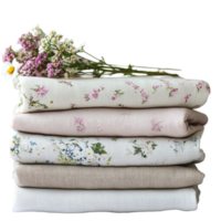 Stacked folded cloths adorned with delicate flowers on a neutral backdrop, stack folded folded cloths with flowers on them, Transparent background png