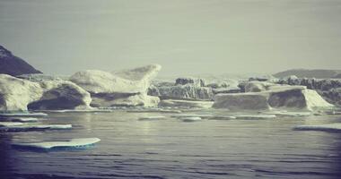 Icebergs calmly floating in a serene Arctic landscape during twilight video