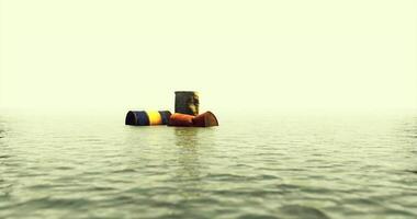 Colorful floating barrels stand out against a misty water backdrop video