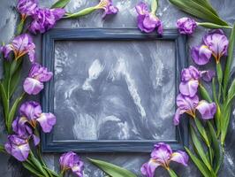Frame with purple iris flowers surrounding. photo