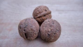 Three Desi Walnuts Isolated, Closeup, Neutral Background photo