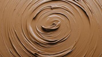 Swirled texture of creamy brown paste elegantly spread in a circular pattern on a smooth surface photo