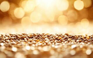 Chia seeds scattered on reflective surface, creating warm, golden ambiance. subtle bokeh effect enhances visual appeal photo
