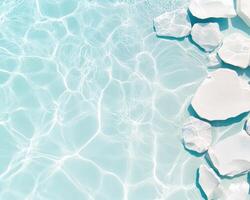 Crystal clear swimming pool water with white stones creating serene atmosphere. gentle ripples and reflections enhance tranquil beauty of scene photo