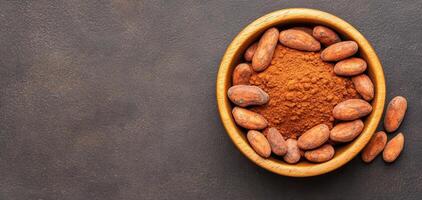 Raw cacao beans and powder in wooden bowl, showcasing rich textures and earthy tones. Perfect for chocolate lovers and health enthusiasts alike photo