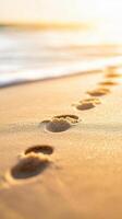 Footprints on sandy beach during golden hour with soft waves. serene scene evokes sense of tranquility and connection to nature, perfect for relaxation and reflection photo