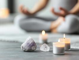 Meditation setup with candles and crystals, creating serene atmosphere for relaxation and mindfulness. soft glow of candles enhances tranquil environment photo