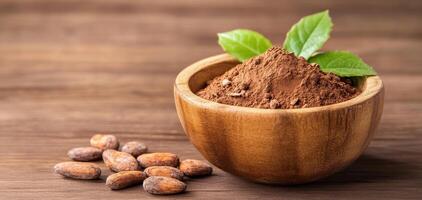 Rich cacao powder and raw cacao beans in wooden bowl, surrounded by fresh green leaves, create natural and earthy aesthetic. Perfect for culinary and health related themes photo