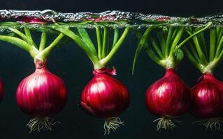 Artistic display of floating red onions in water, showcasing vibrant colors and textures, creating refreshing and lively atmosphere photo