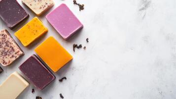 Handmade organic soap bars with natural textures and vibrant colors, arranged on marble surface. Perfect for skincare enthusiasts and eco friendly products photo