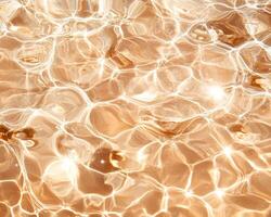Sunlit rippling water in pool creates abstract texture with shimmering reflections. warm tones and fluid patterns evoke sense of tranquility and relaxation photo