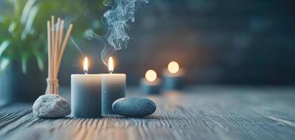 Calming meditation space with candles, incense, and stones creating serene atmosphere. soft glow of candlelight enhances relaxation and mindfulness photo