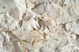 A close up of a white stone wall photo