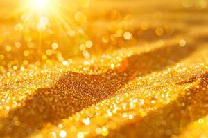 Golden sand background with sun shining through photo
