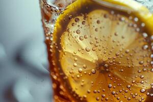 A close-up view of a refreshing iced drink featuring vibrant lemon slices submerged in carbonation, illustrating a perfect summer refreshment photo