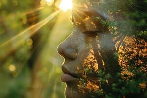 A woman's face is reflected in the sun through a tree photo