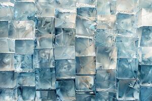 The image features a collection of clear ice cubes arranged closely, revealing various shapes and textures that catch light reflections, emphasizing their clarity and coolness photo