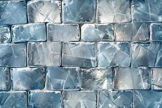 The arrangement of transparent ice blocks highlights unique patterns and reflections, creating a visually appealing surface that catches the sunlight beautifully photo
