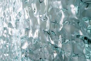 The composition features a detailed pattern of rippling translucent glass that interacts with light, creating mesmerizing reflections in a contemporary space photo