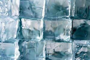 Clear ice cubes are arranged closely, showcasing their smooth surfaces and subtle reflections. The light enhances the clarity and color of the ice, creating an appealing visual photo