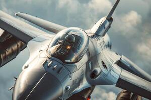 A fighter jet glides skillfully through fluffy clouds as the pilot navigates the skies, showcasing aerial prowess during a training exercise photo