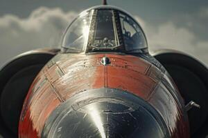 A vintage military aircraft is prominently displayed, highlighting its cockpit and sleek design. The sun reflects off the surface, creating a striking visual against the clouds photo