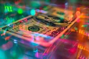 A one hundred dollar bill is illuminated by a display of colorful lights, creating a lively atmosphere as reflections and patterns dance around it in a dark environment photo