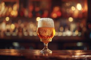 A cold glass of beer with a creamy foam sits on a polished wooden bar. The background is softly illuminated, creating a warm and inviting atmosphere photo