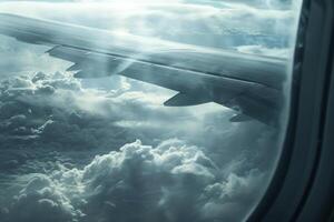 The airplane wing extends into the cloudy sky, surrounded by thick layers of clouds and a soft, diffused light creating a serene atmosphere during the journey photo