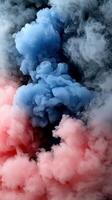 A blue and red smoke cloud on a black background photo