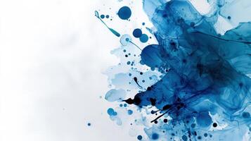 Blue ink splatter on white background photo