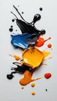 Colorful paint splashes on white background photo