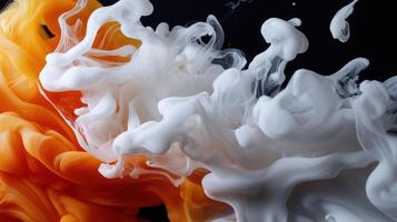 White and orange liquid flowing in a black background photo