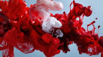 Red and white ink on a blue background photo