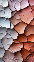 A close up of a cracked wall with paint on it photo
