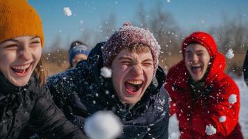 A group of young people having fun in the snow photo