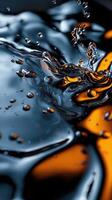 A splash of water with a few drops of oil floating on top photo