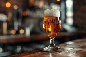 A beautifully poured glass of golden beer rests on a polished wooden surface, showcasing its frothy head as warm lights illuminate the inviting pub setting photo