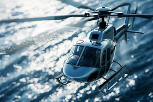 The helicopter hovers above the shimmering water, casting a shadow on the surface while demonstrating its agility and design in bright daylight photo